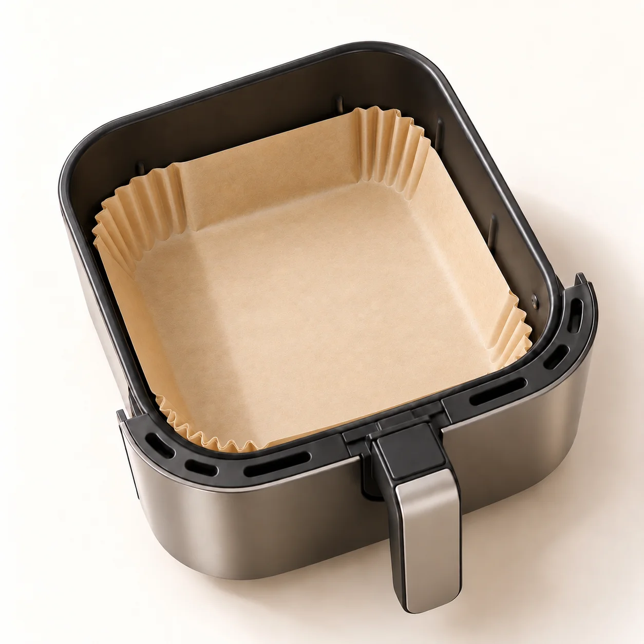 Papel ajustado al tamaño de una cesta cuadrada de airfryer